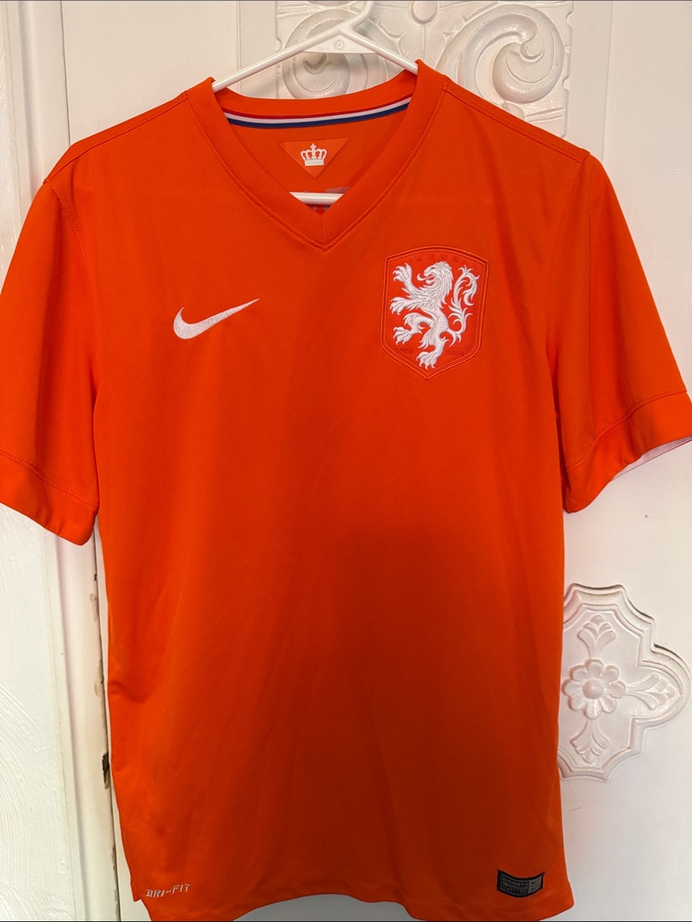 Nike Kids Orange Soccer Jersey with White Crest and Swoosh